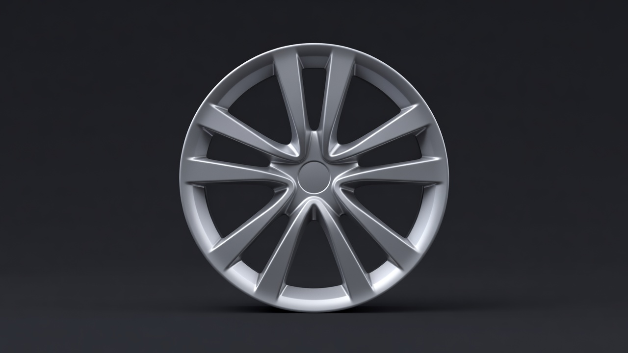 Soft-lit rendering of a satin multi-spoke alloy wheel isolated against a plain dark background